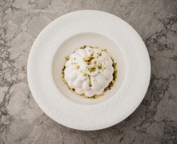 Italian meringue with pistachio cream and cherries