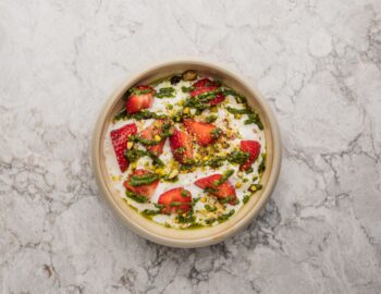 Stracciatella with strawberries and pistachios
